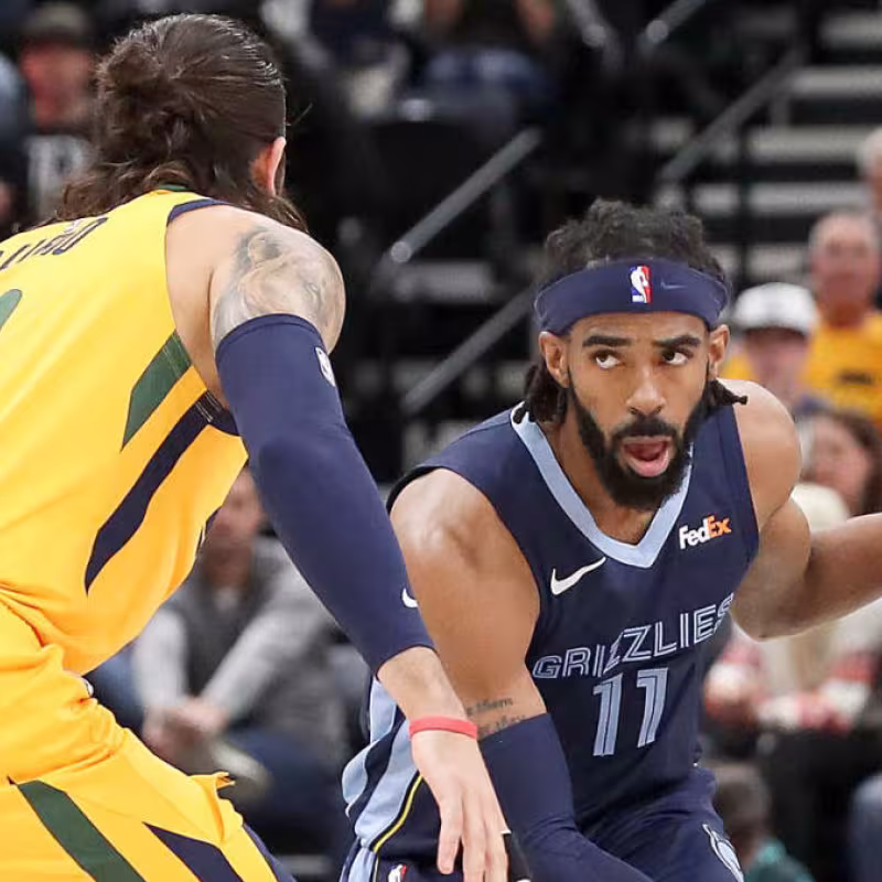 Mike Conley, frente a Ricky Rubio.