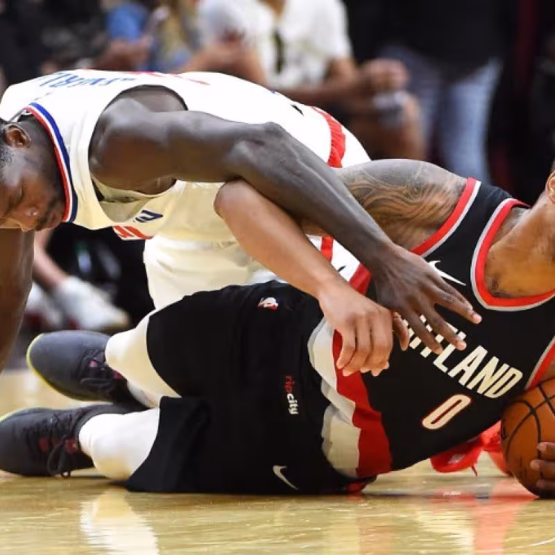 Patrick Beverley y Damian Lillard, jugadores de la NBA.