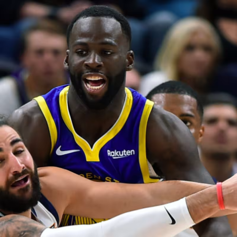 Draymond Green, en una acción con Ricky Rubio.