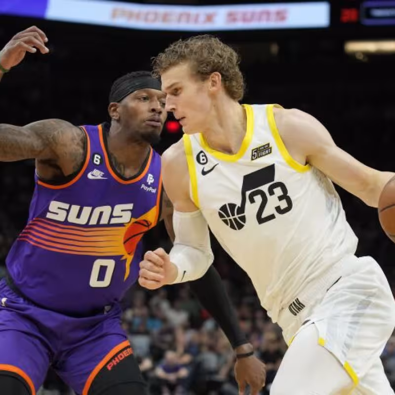 Lauri Markkanen, defendido por Torrey Craig