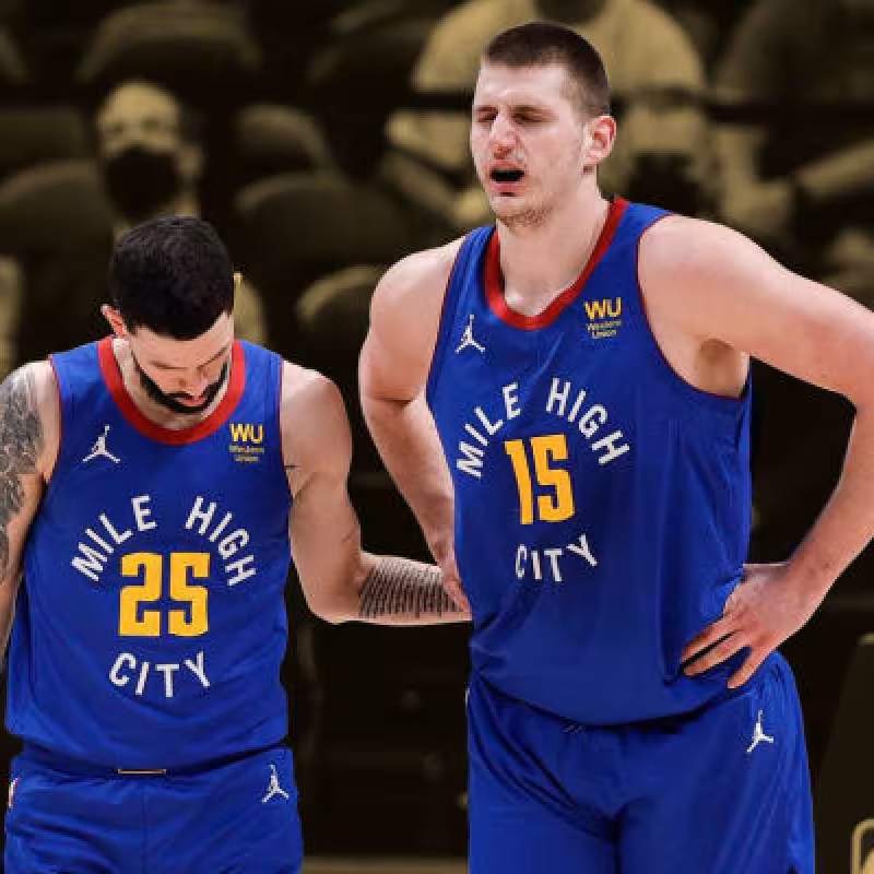 Austin Rivers y Nikola Jokic