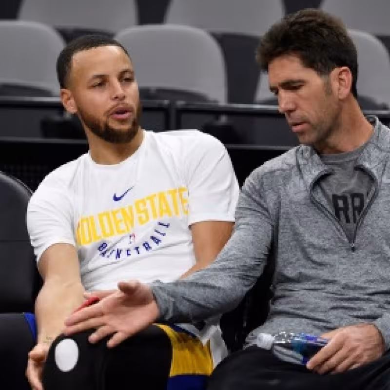 Bob Myers y Stephen Curry.