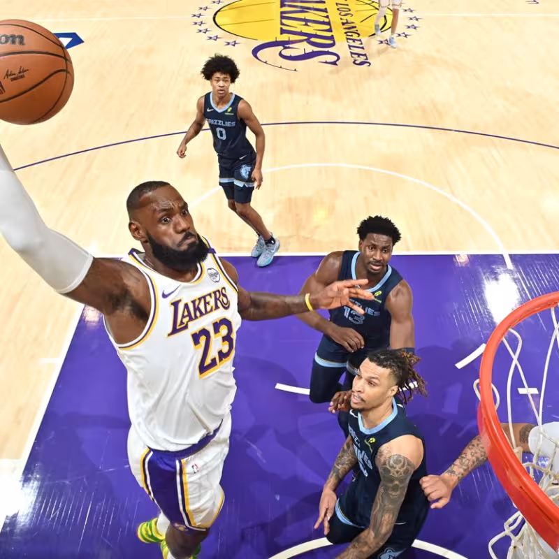 LeBron James, slam dunking the hoop.