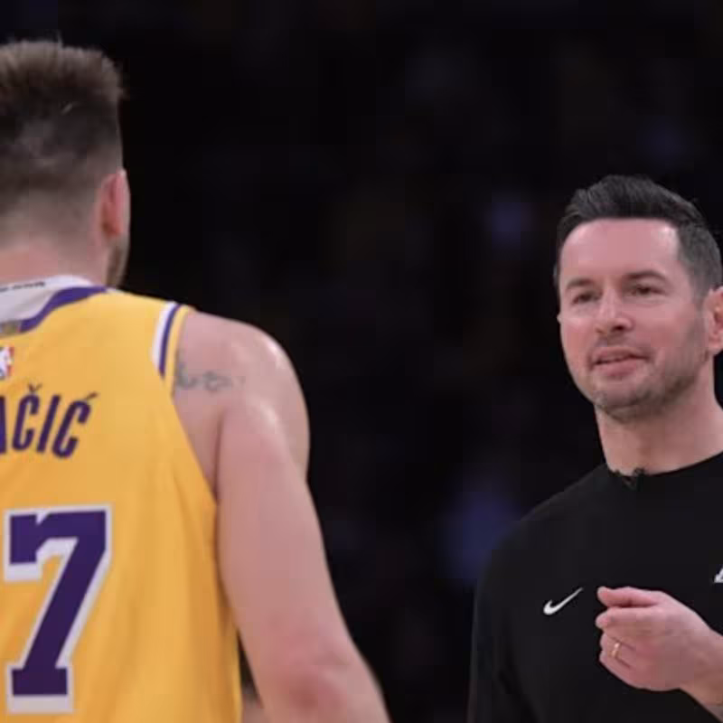 Luka Doncic, along with his coach JJ Redick.