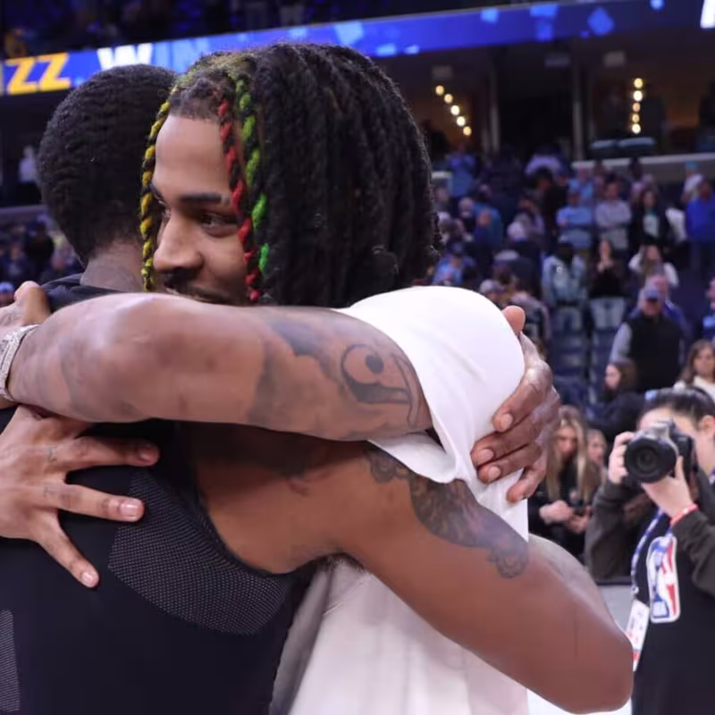 Kyrie Irving and Ja Morant, melted in a hug after facing each other in a game.