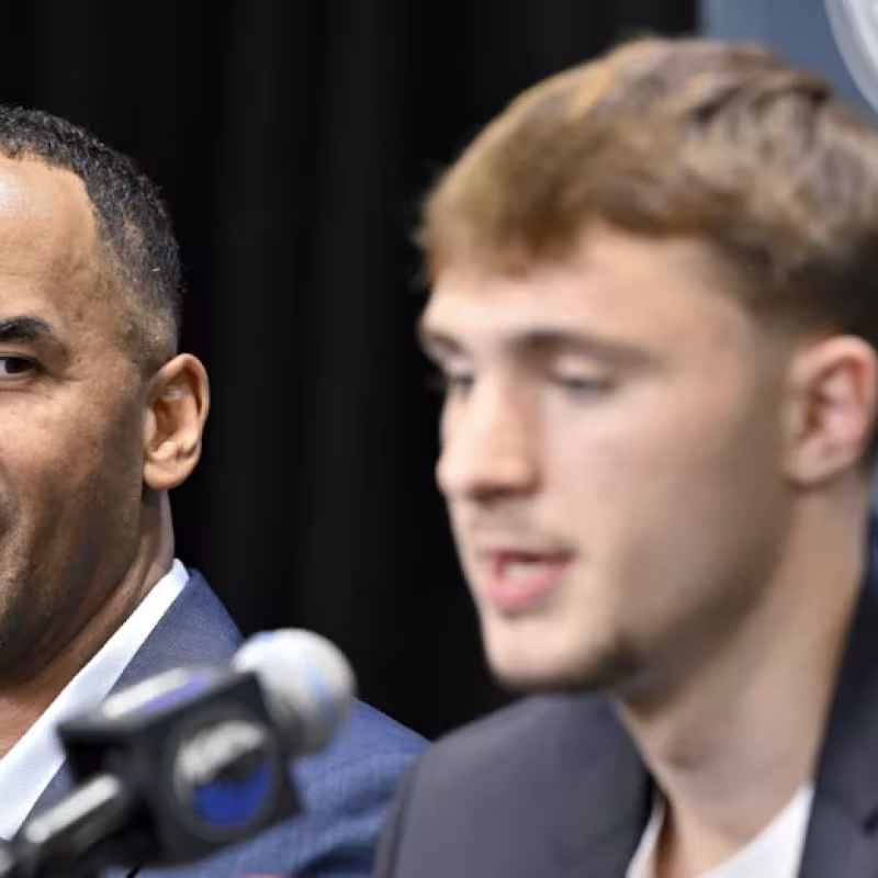 Cooper Flagg, alongside Nico Harrison, in his debut with the Dallas Mavericks.