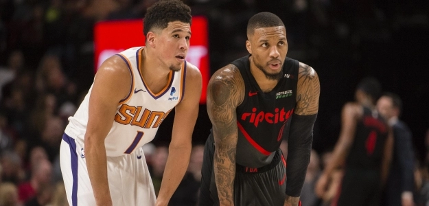 Devin Booker y Damian Lillard, en un Suns-Blazers.