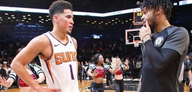 Devin Booker y D'Angelo Russell durante un encuentro de la presente temporada.