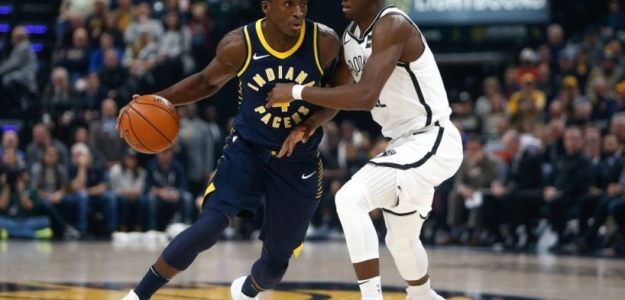 Victor Oladipo, frente a Caris LeVert.