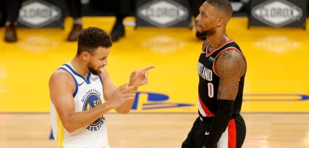 Stephen Curry y Damian Lillard en un partido de la NBA.