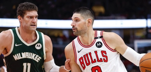 Nikola Vucevic defended by Brook Lopez.